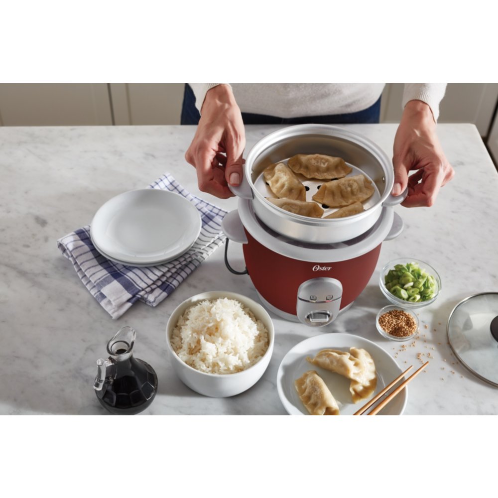 https://s7d1.scene7.com/is/image/NewellRubbermaid/4722000000-oster-rice-cooker-with-steamer-red-top-down-with-food-lifestyle-with-talent-1?wid=1000&hei=1000