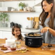 woman and child cooking with slow cooker image number 4