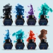 Eight Waterman ink bottles with ink colored smoke rising behind them. image number 3