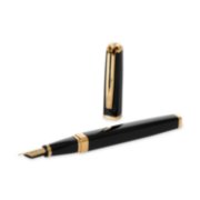 An Exception fountain pen with gold trim laid next to an upright pen cap. image number 6