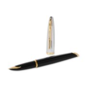 A Carene fountain pen with gold trim laid next to a pen cap stood upright. image number 3
