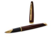 A Carene rollerball pen with gold trim laid next to an upright pen cap. image number 3
