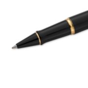 Closeup of an Expert rollerball pen tip and barrel with gold trim. image number 4