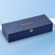 A closed gift box over a colorful background. image number 6