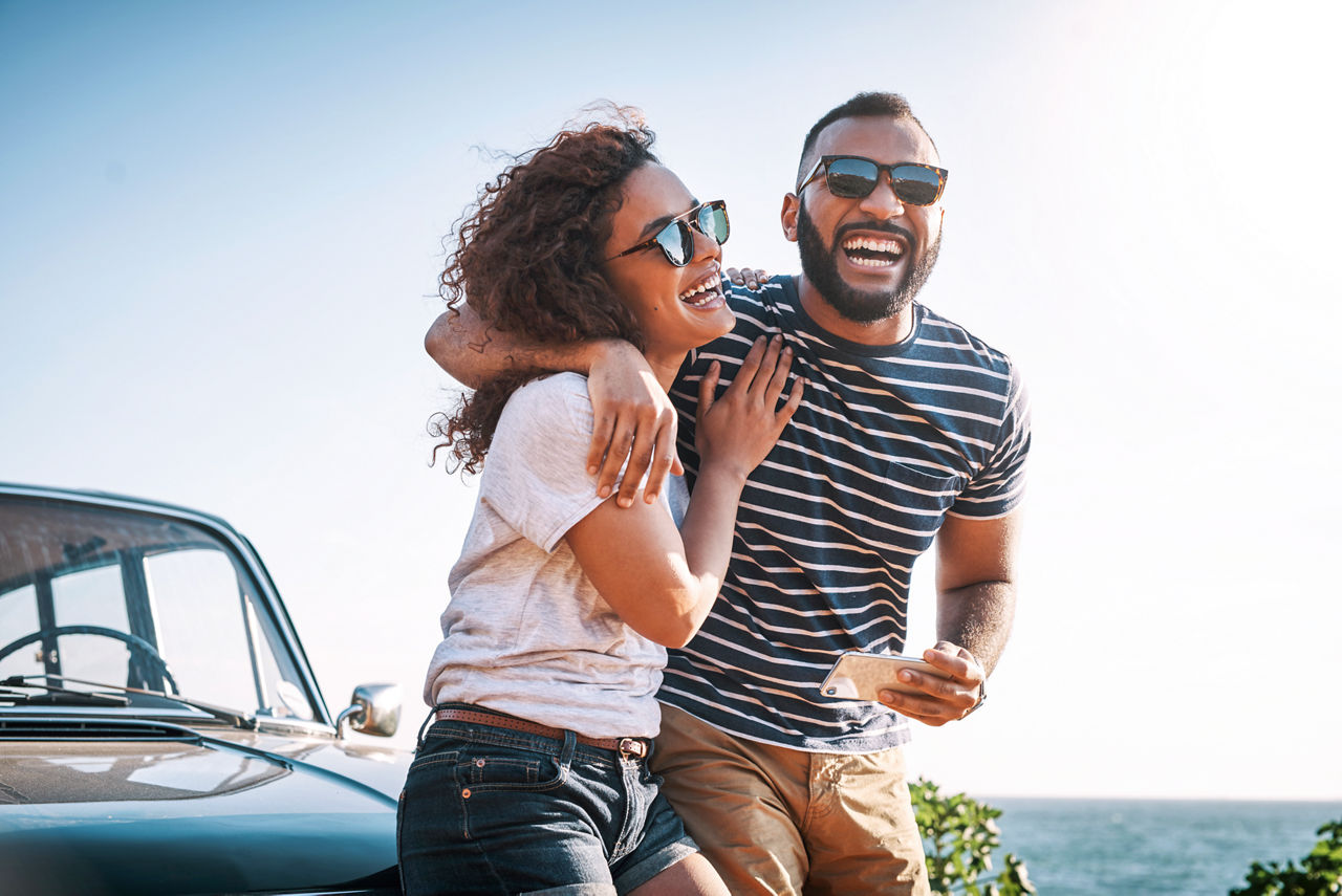 Shot of a young couple enjoying a summer’s road trip together. Small version