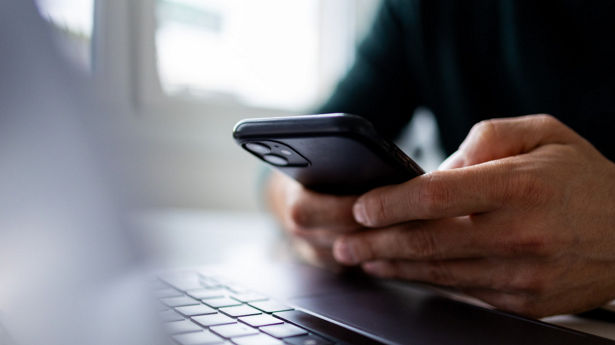 Close up on man hand using phone