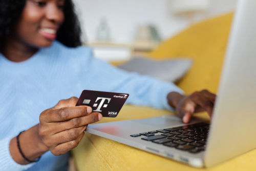 Customer holding T-Mobile Visa