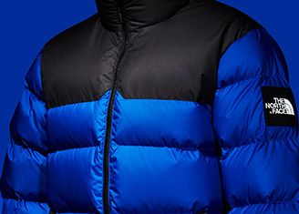 blue and black north face puffer