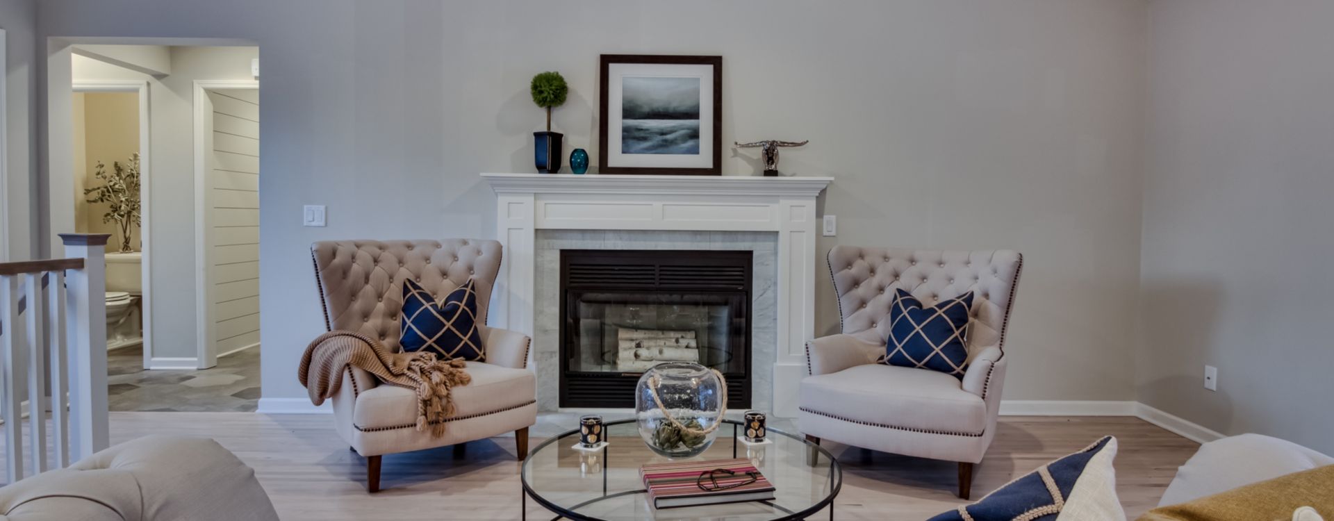 Tiled fireplace in French country living room.