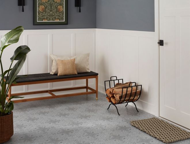 This elegant entryway features an ornate black patterned floor.