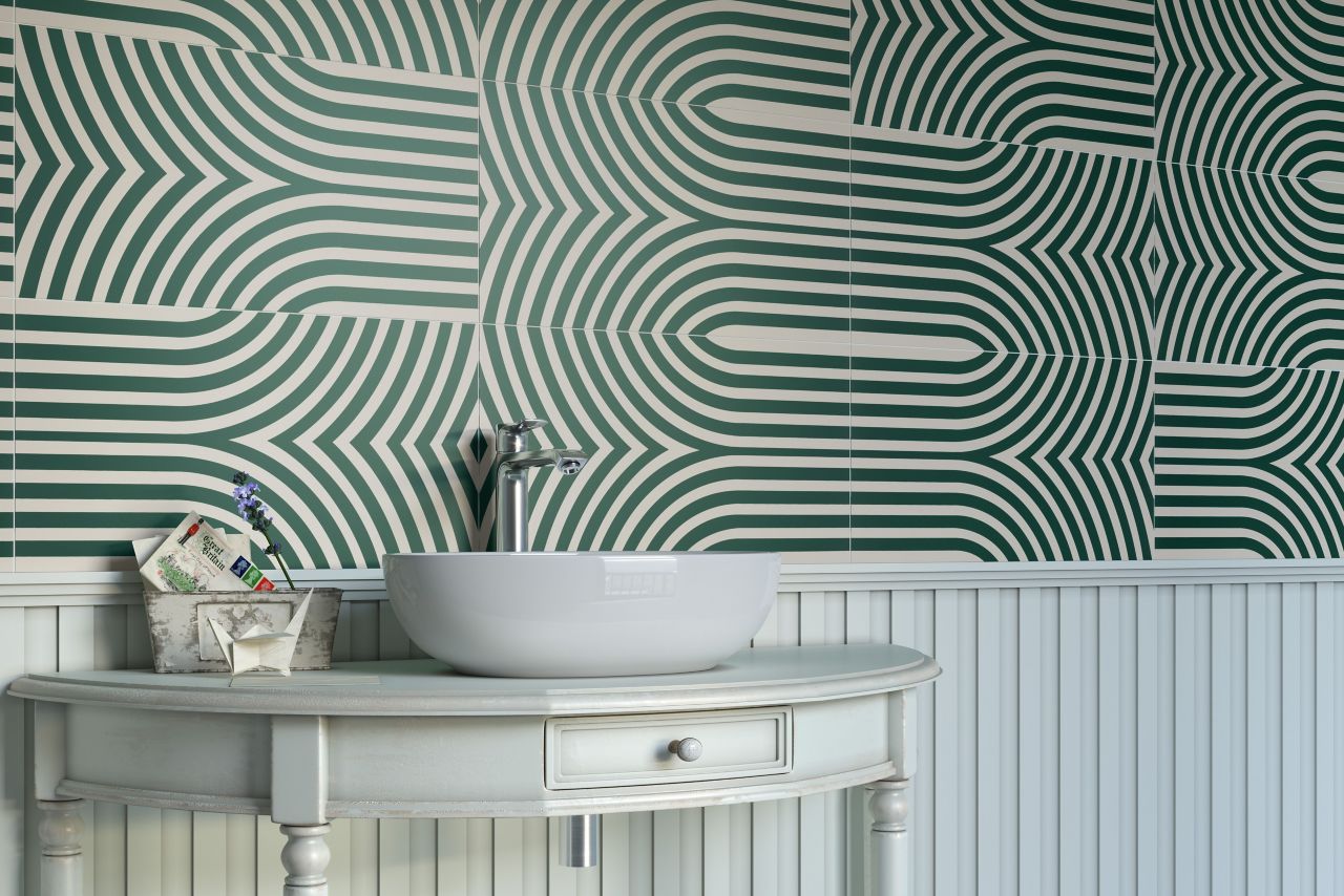 This groovy bathroom features a patterned backsplash tile with green geometric lines.
