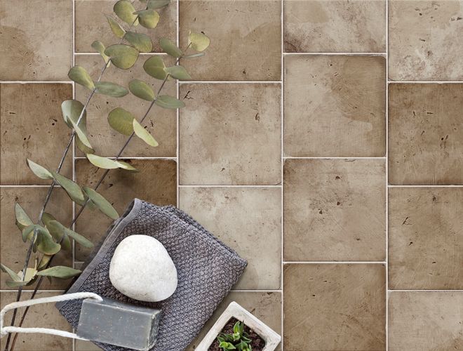 Aerial shot of a light-brown square porcelain tile patio floor.