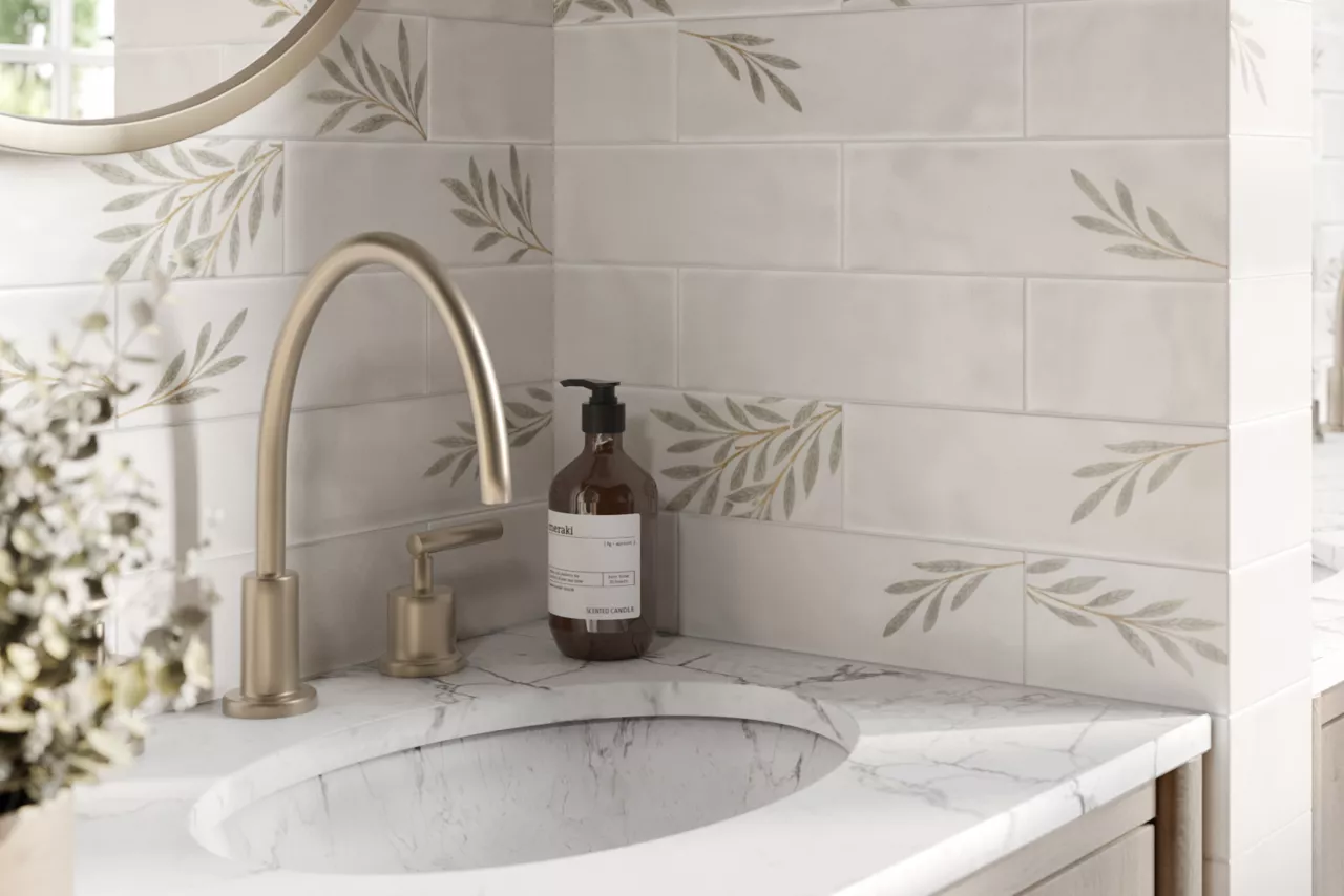 This serene bathroom features a leaf-patterned subway tile. 