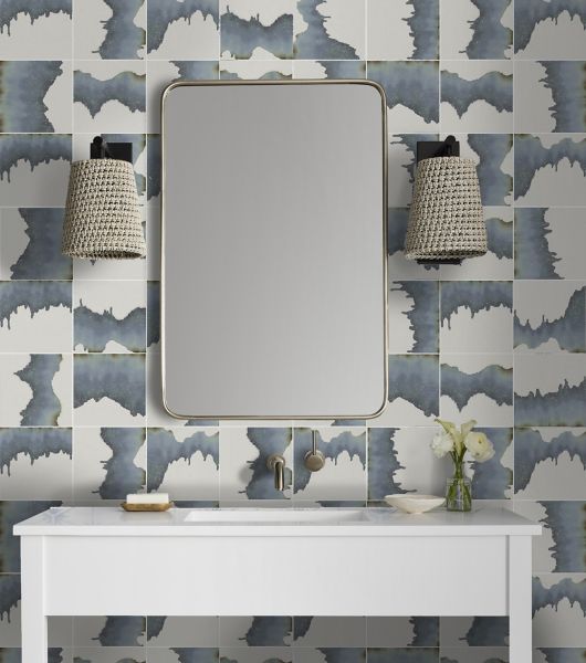 A coastal chic bathroom vanity with abstract blue tile. 