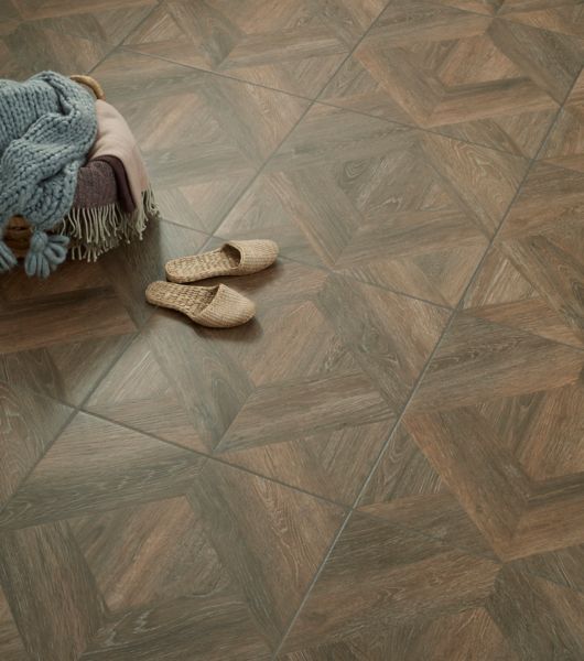 A wood-look diamond patterned floor tile.