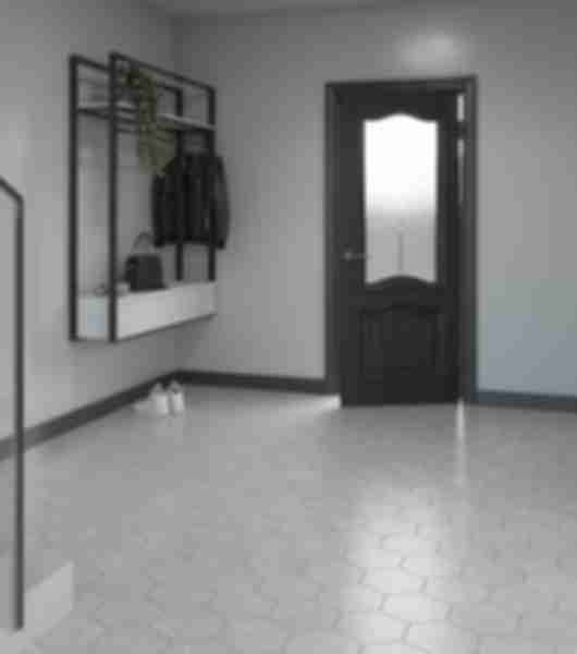This entryway features a white hexagon-shaped tile floor.