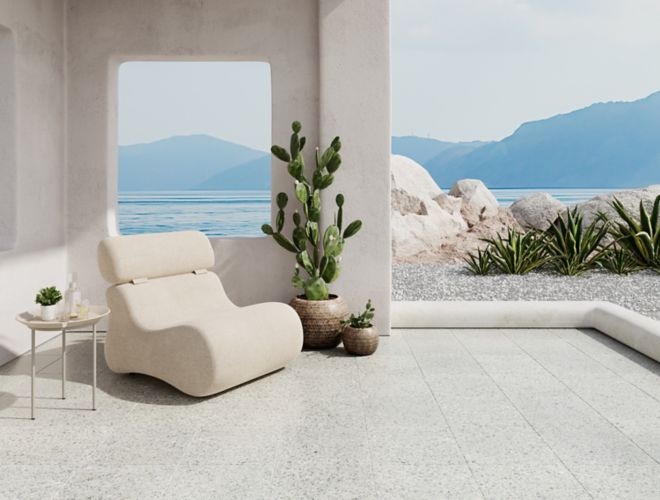 An open outdoor space with grey and white terrazzo tile floor.