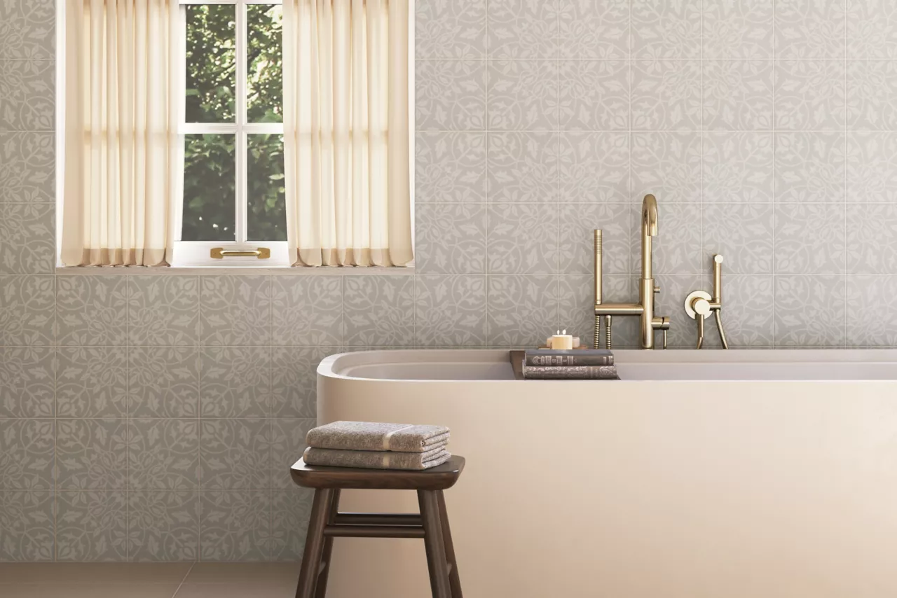 This elegant bathroom features an ornate grey and white wallpaper-inspired patterned wall tile.  