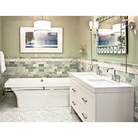 Thumbnail image of Bathroom area with Green tones and natural neutral tones of marble tile. Wainscotting has a subway tile with an onyx mosaic border and a marble profile that coordinates with the subway tile. A marble baseboard adds a custom feel.