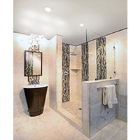 Thumbnail image of Bathroom area featuring a walk in shower where tile runs from floor to ceiling different shapes and sizes make up this lock where is stacked patterns on walls and floor are introducted with large mosaic waterfall lake areas and smaller mosaic shower pan unique barrel style vanity with mirror it's similar what tone and unique light fixture finish the look.