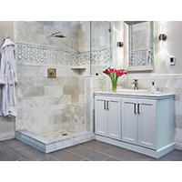 Thumbnail image of Bathroom area with natural stone tile walls and shower area with matching profile pieces.  A porcelain tile is laid in a staggered pattern on floor area. A mosaic is framed on shower walls.