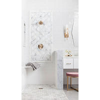Thumbnail image of Bathroom with white subway tiles ran horizontally and marble accents trim and shower pan. Campaign fitures and a floating white vanity with marble tile top.