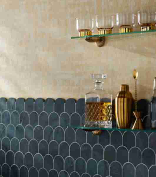 This elegant home bar uses dark green scalloped marble tile by Alison Victoria (exclusive to The Tile Shop) for a sophisticated and luxurious look.