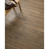 Thumbnail image of Amazona Oliva wood look tile. A solid choice for use as a wall tile or floor tile, this wood-like tile delivers warmth and natural beauty with easy maintenance. Each 8" x 36" piece of porcelain tile offers multiple design options with the look of dark brown with a hint of grey in the bold woodgrain.