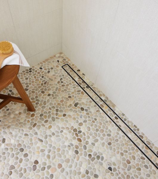 When I step out of the shower, what makes the tile floor so much colder  than the bathroom mat?