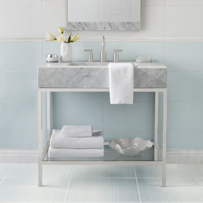 Lovely bathroom with subtly patterned blue and white tile.