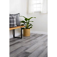 Thumbnail image of Area with focus on floor tile in a  wood-look tile by experimenting with the subtle, washed-out color of black white and grey.