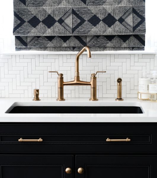 White herringbone porcelain tile kitchen backsplash