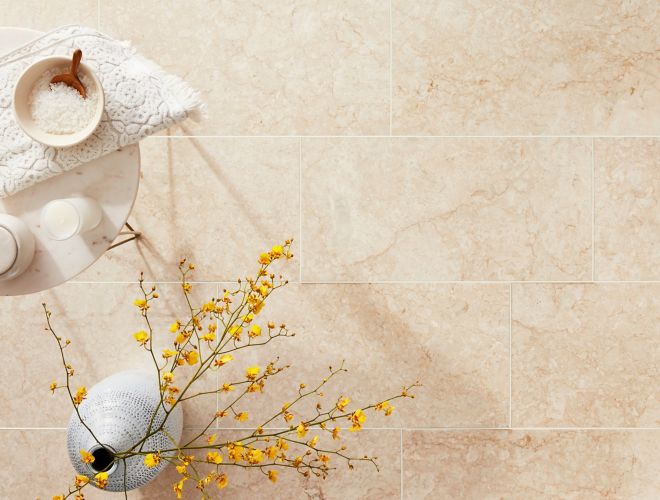 Beige and cream stone floor in a spa-like setting.