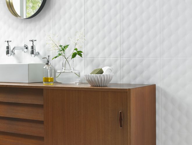 Modern bathroom vanity with white textured designer wall tile.