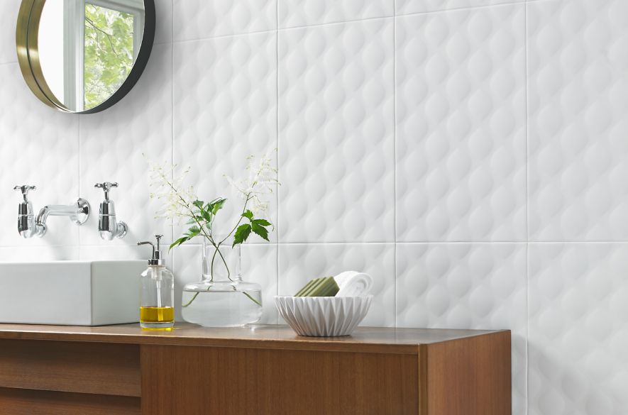 Modern bathroom vanity with white textured designer wall tile.