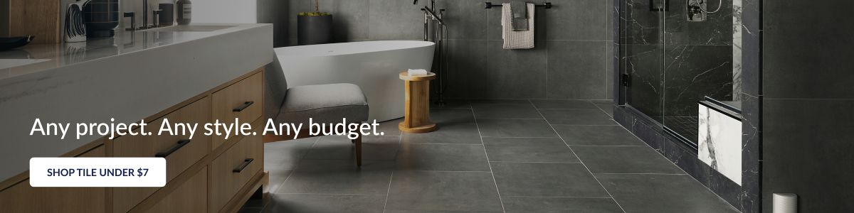 Love the home you're in. Shop Tile Under $7. This modern bathroom features large-format grey floor and wall tile and dark grey with white veining shower tile. 