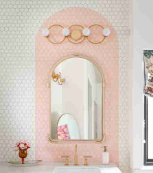 Bathroom with a white and pink tiled backsplash