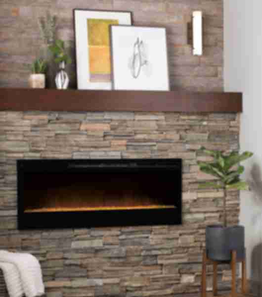 Fireplace surround with natural slate stacked stone a wood look porcelain tile above. All tile is natural colors of cool and warm tones.