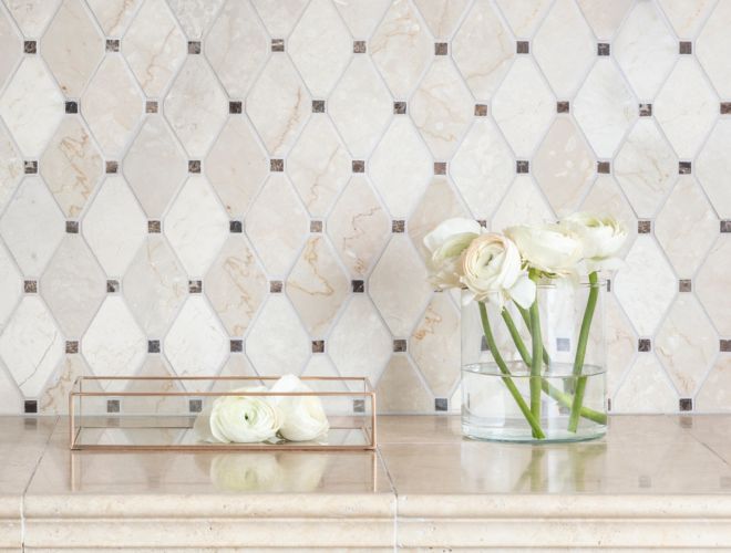 Brown and ivory marble diamond-shaped mosaic bathroom backsplash.