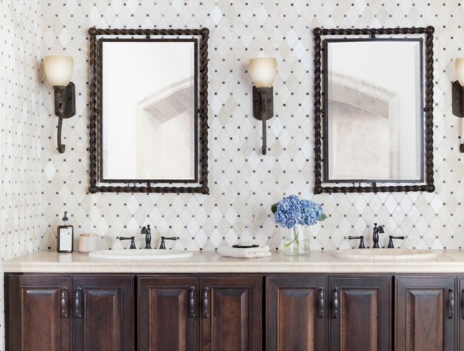 Traditional bathroom with cream and brown marble mosaic backsplash.