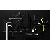Thumbnail image of Black Marquina marble tile in various shapes and sizes with chrome faucet,  calla lily, and perfume bottle.