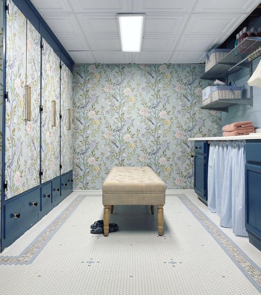 Large laundry room featuring a floor covered in penny round mosaic tile in shades of taupe, white and light blue.