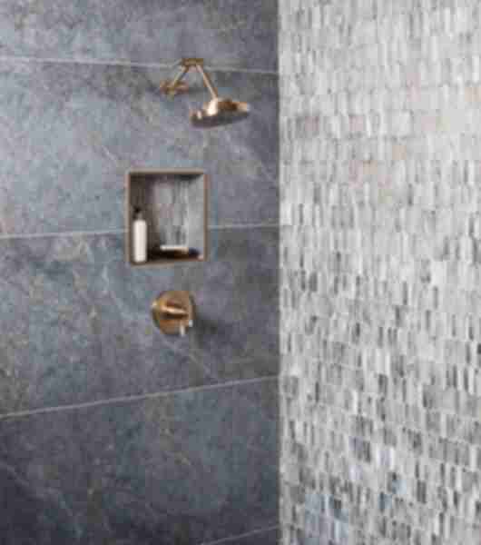 Shower with dark-blue porcelain tile with streaks of grey and brown. Silver glass mosaic accent wall.