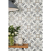 Thumbnail image of Close up of wall tile uses black, grey and tan colors to create an assortment of intermingled geometric shapes and flourishes. Laid out in a diagonal pattern.