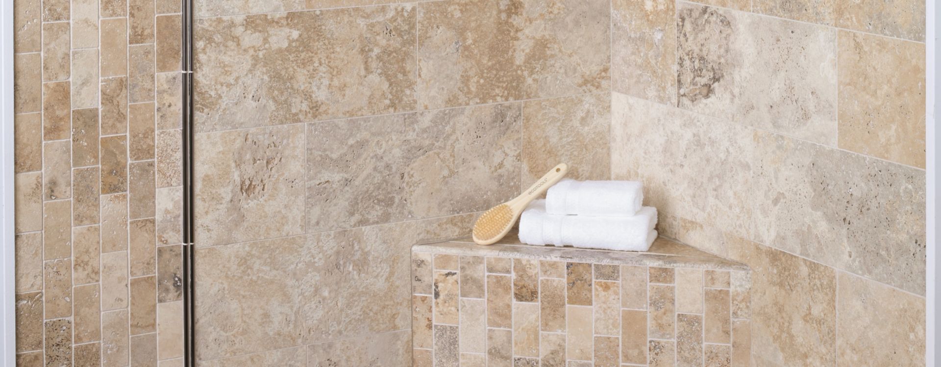 Walk In shower tiled in natural travertine stone