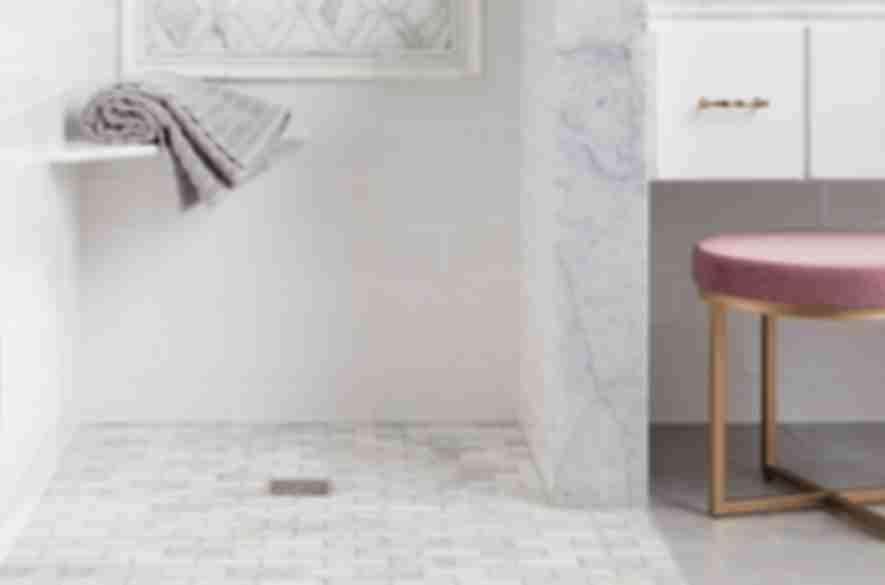 marble tiles in bathroom shower area.