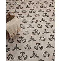 Thumbnail image of Porcelain Hex tile featuring three unique black designs that contrast the taupe cement-look background.