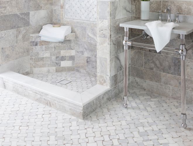 Traditional bathroom with grey travertine and marble tile.