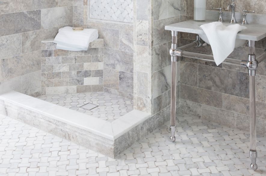 Traditional bathroom with grey travertine and marble tile.