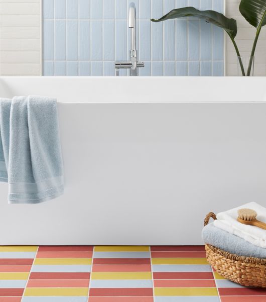 blue yellow red pink colorful tile bathroom floor